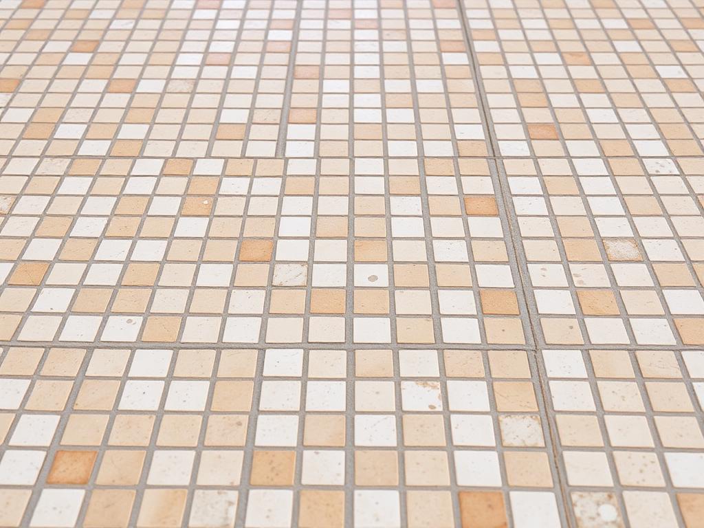 Restored mosaic tile floor with bright, clean grout lines after professional tile and grout cleaning